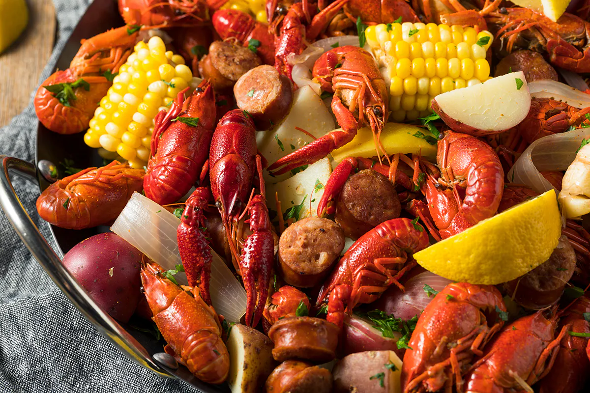 Boiled crawfish platter with corn potatoes and sausages at Crab 99, a Cajun Seafood & Grill Restaurant in Phoenix