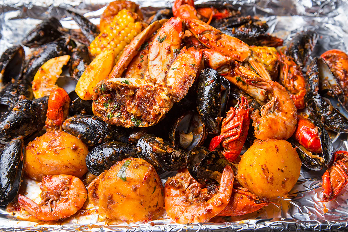 Spicy mixed seafood boil with crab shrimp mussels and potatoes at Crab 99, a Cajun Seafood & Grill Restaurant in Phoenix