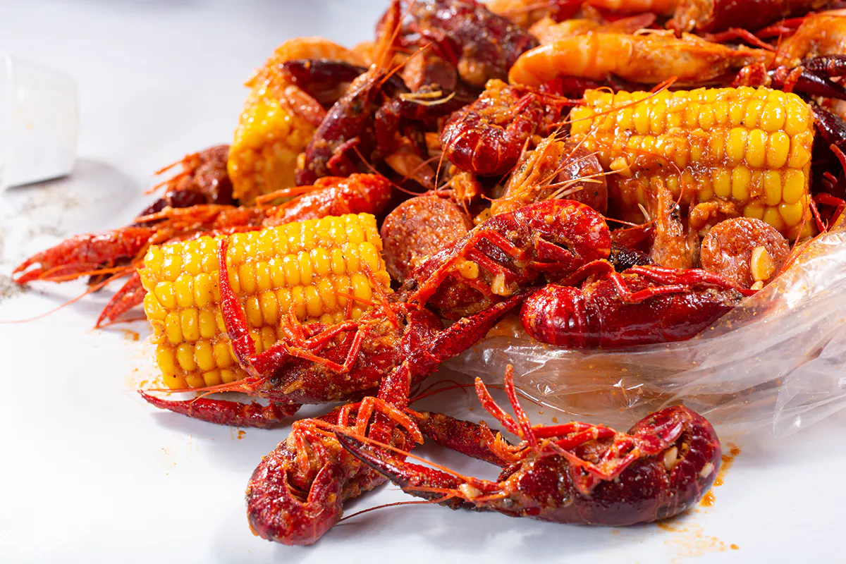 Spicy seasoned crawfish with corn and sausages at Crab 99, a Cajun Seafood & Grill Restaurant in Phoenix